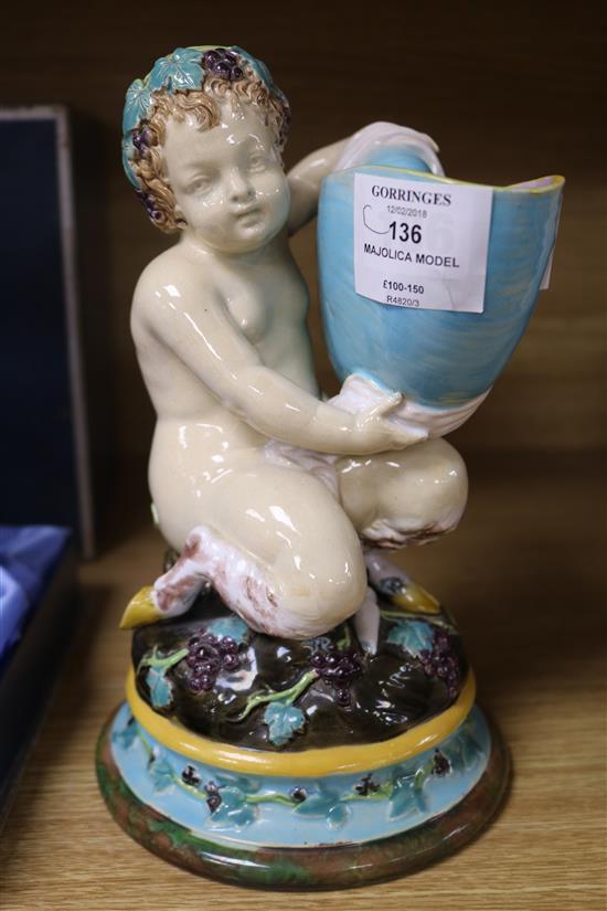 A Victorian majolica model of a faun holding a nautilus shell height 22cm